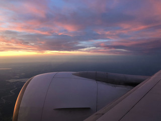 Fototapeta na wymiar Sunset when flying above Europe