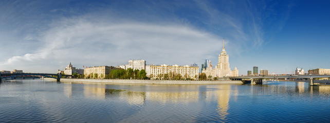 Sunny morning view of Smolenskaya embankment and Moskva river, Moscow, Russia.