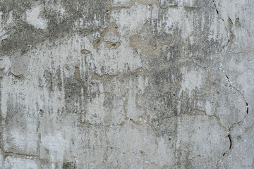 Wall fragment with scratches and cracks