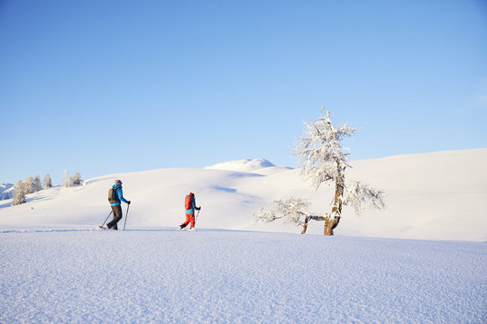 Austria, Tyrol, couple snowshoeing