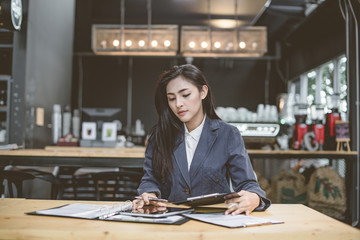 Young attractive Asian business woman sleeping,