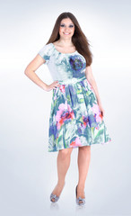 in full growth.Beautiful woman in summer dress .isolated on white.plus size