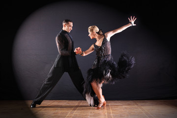 dancers in ballroom isolated on black background