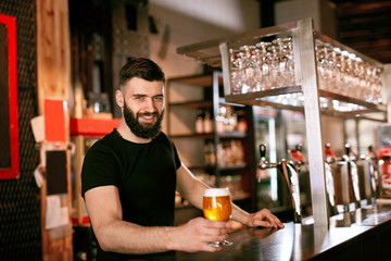 Craft Beer. Man Holding Glass With Beer In Pub