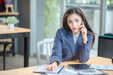 Business woman working in office with documents