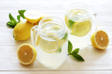 Summer healthy non alcoholic cocktails, citrus infused water drinks, lemonades with lime lemon or orange, diet detox beverages.