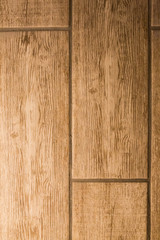 Fototapeta premium Wooden design tiles for floor for interior design. Brown texture background.