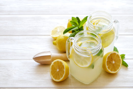 Summer healthy non alcoholic cocktails, citrus infused water drinks, lemonades with lime lemon or orange, diet detox beverages.