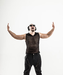 Naklejka premium emotional and charismatic DJ - rapper with headphones on a light