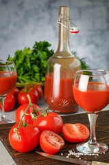 Tomato Juice and Fresh Tomatoes isolated on a White Background