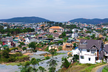 Fototapeta premium Top view Dalat city with blue sky and clouds, Dalat Vietnam. Vacation, holiday concept.