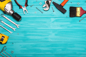 A set of construction tools on a wooden background. The concept of celebrating the father's day.