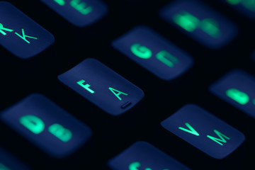 Hi tech computer mechanical keyboard with backlight rgb illumination. Close up  of computer gaming accessory. 