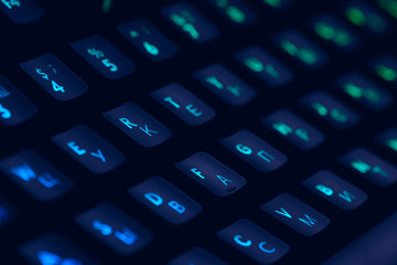 Hi tech computer mechanical keyboard with backlight rgb illumination. Close up  of computer gaming accessory. 