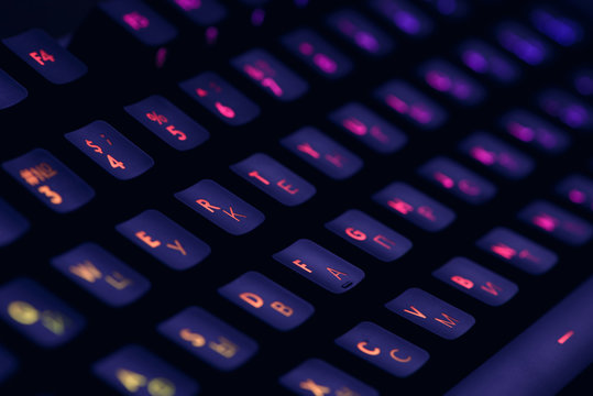 Hi tech computer mechanical keyboard with backlight rgb illumination. Close up  of computer gaming accessory. 