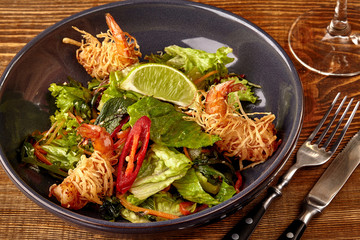 Prawn salad with lettuce and lime.