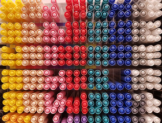 Row of colorful pen cap in store shelf display for sale. Pen cap pattern for background.