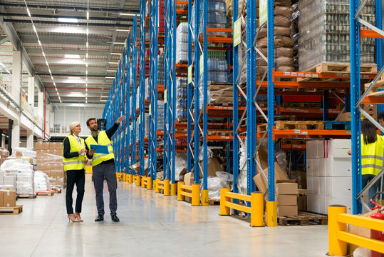 Managers walking thru warehouse