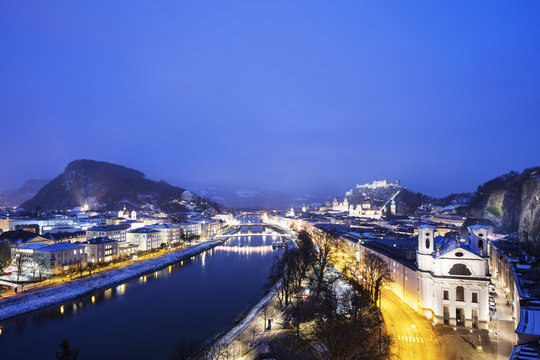 View over the old town, Markus church and Hohensalzburg Castle at dusk, Salzburg, Austria