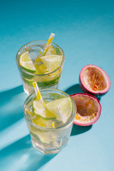 Cold fresh lemonade drink on blue background