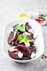 Healthy roasted beetroot feta cheese salad. Selective focus, space for text.