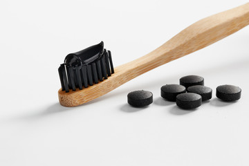 Toothbrush with black charcoal toothpaste