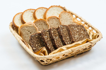 A Variety Of Freshly Baked Bread In A Wicker Basket