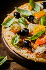 Traditional italian pizza on wooden table