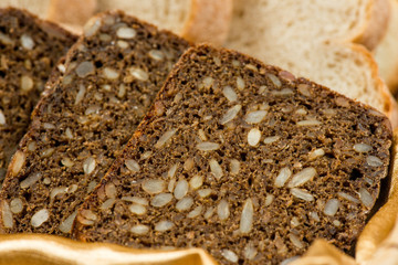 A Variety Of Freshly Baked Bread In A Wicker Basket
