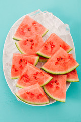 Fresh watermelon slices on ice cubes