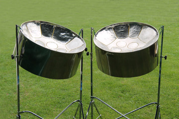 A Pair of Musical Metal Steel Drums on Stands.