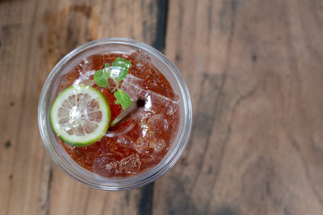 tea cocktail cola with lemon and ice