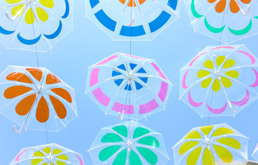 Colorful umbrellas hanging in the sky