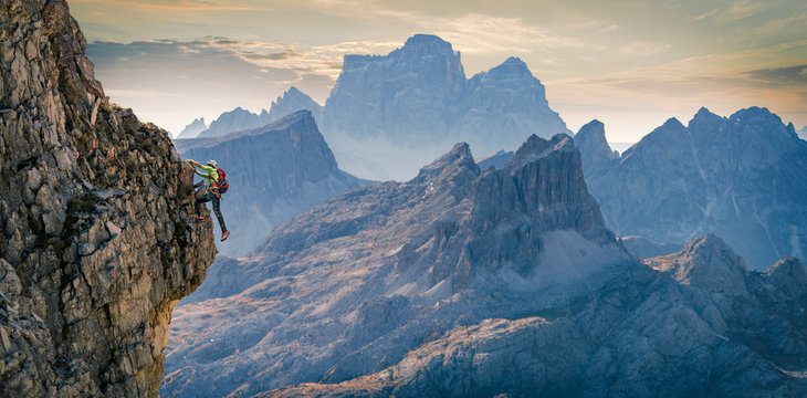 Climber on rocky wall, Dolomites, Cortina d'Ampezzo, Veneto, Italy