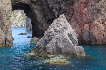 Aeolian Islands in the Tyrrhenian Sea, near Sicily. Rocky, lava-formed picturesque and rough shores of the Lipari island
