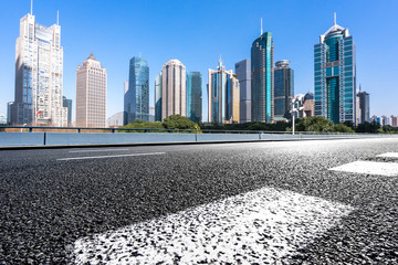 empty asphalt road with office building