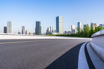 city skyline with asphalt road