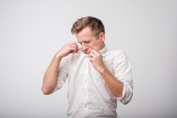 Caucasian man sweating very badly under armpit.