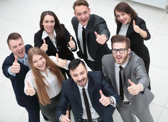 successful business team holding up a thumbs up