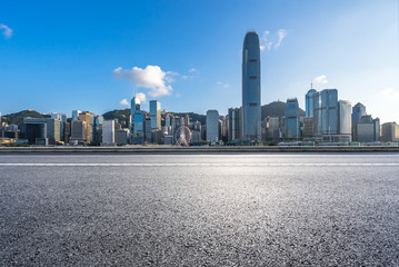 empty asphalt road with city skyline in hongkong china