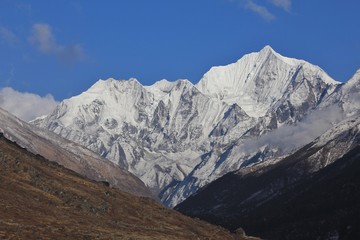 Beautiful shaped mount Gangchenpo on a clear spring day. Scene in the Langtang national Park, Nepal.