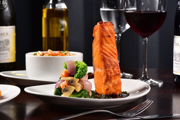 Grilled salmon fillet served with vegetables