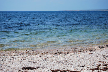 pebble beach and blue sea in summer