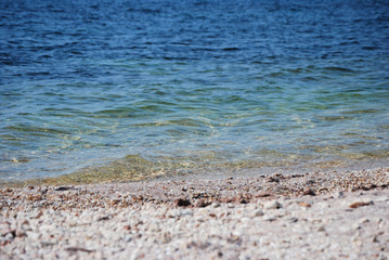 pebble beach and blue sea