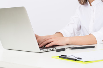 Business young woman typing on laptop computer at office 