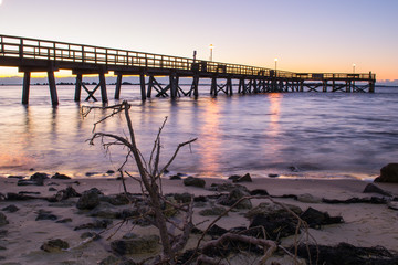 Dock at sunrise in Southport, North Carolina beach vacation destination.