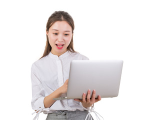 Talking to the other side. Young woman happy working on laptop.