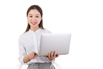 Young woman standing on white holding a laptop computer. Young businesswoman with laptop isolated on white and standing