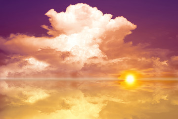 Naklejka na ściany i meble reflection of sunset heap cloud on lake surface