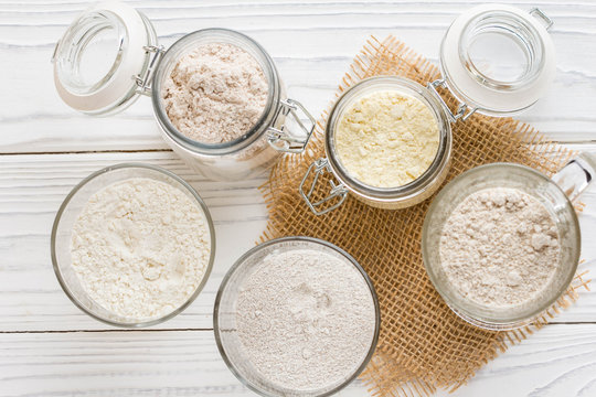 Different flour jars, wheat, corn, rye, oats, spelt, flax